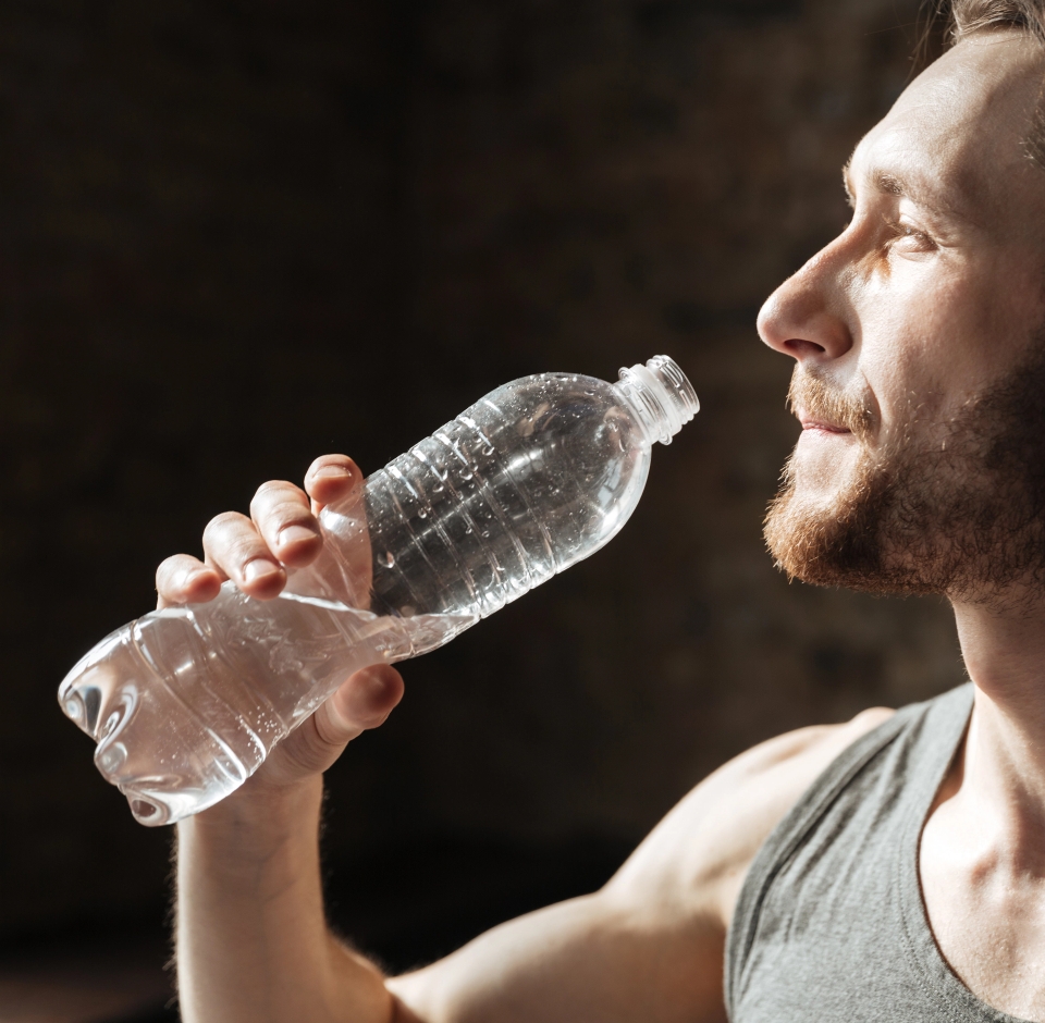 strong sportsman gym drinking water
